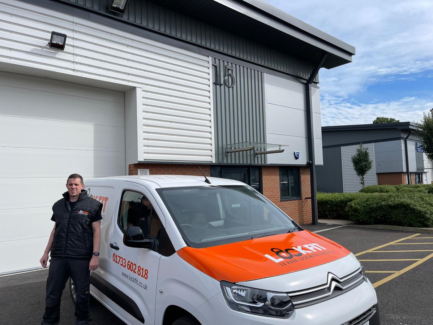 Matt, LockFit Peterborough locksmith, beside his van