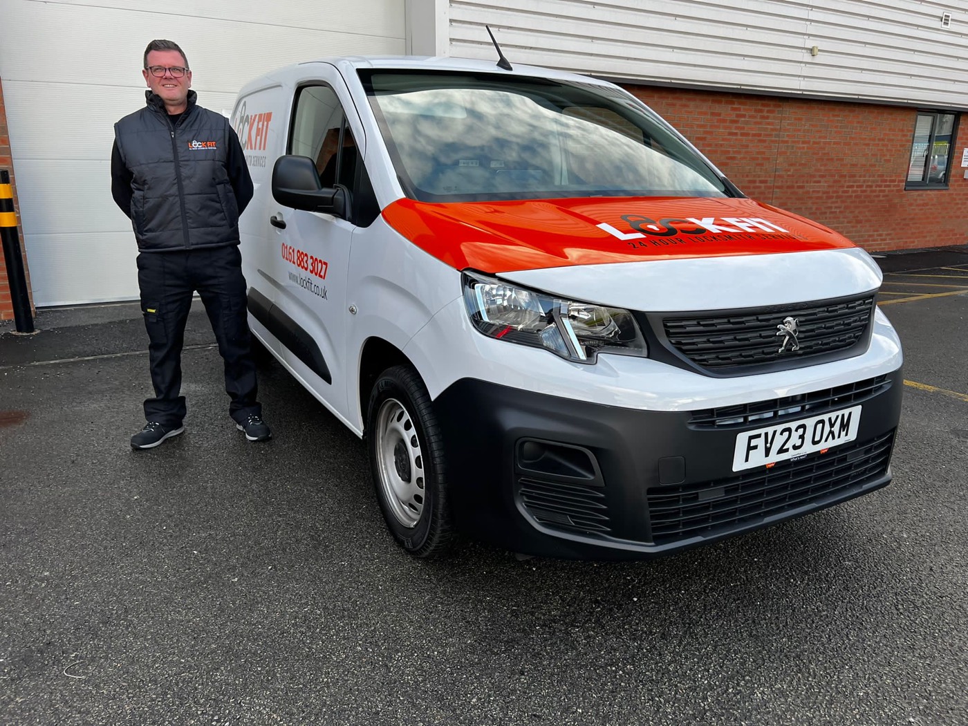 Steve, LockFit Manchester locksmith, beside his van